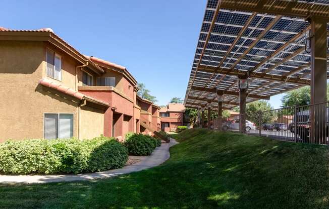 a view of a building with a walkway under a canopy