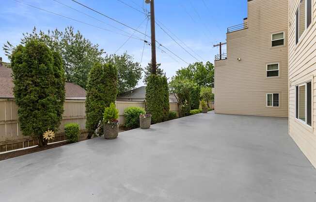 Side view of the building with outdoor space at Hill Crest Apartment Homes, Seattle, Washington 98126