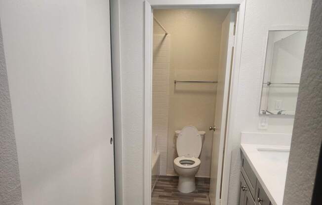 2x2D Bathroom with a toilet and a mirror.