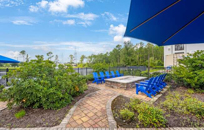 the preserve at ballantyne commons community patio with blue chairs and a fire pit