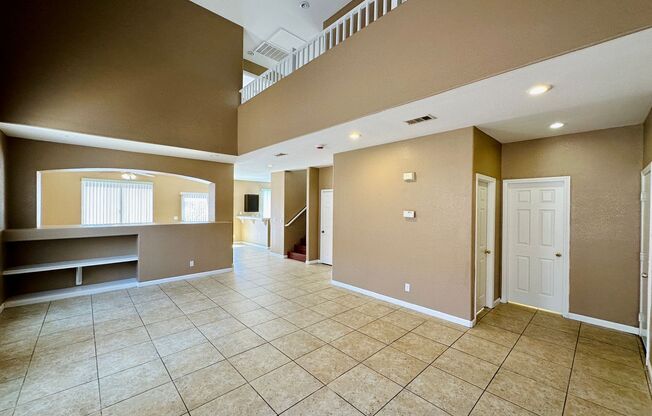 Spacious family home near Silverado Ranch park with 5 bedrooms and one bed & bath downstairs!