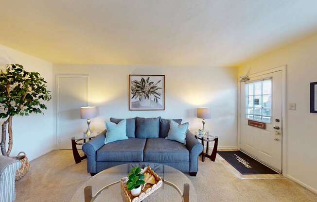 a living room with wall to wall carpet