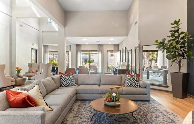 A living room with a grey sofa and a coffee table.