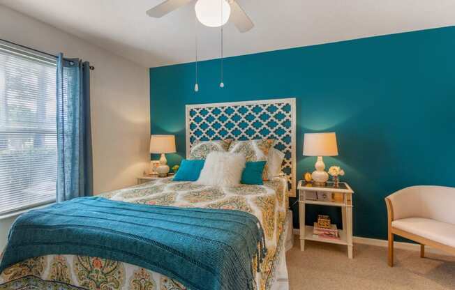 Bedroom with accent wall and furniture