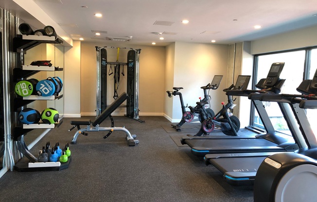 Gym with cardio equipment l Rasa Apartments in Oakland CA