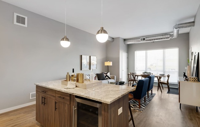 Kitchen island and bright windows at Nuvelo at Parkside in Apple Valley, MN