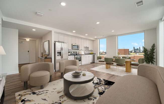 a living room with couches and chairs and a table