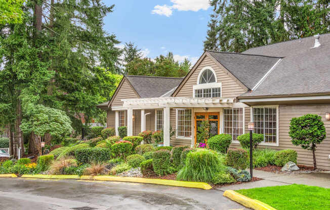 A house with a grey roof and a brown front door.