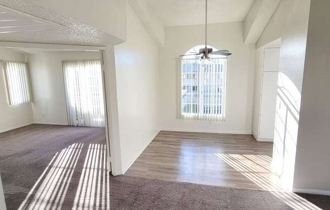 Enterance view of one-bedroom apartment with living room, dining room and bedroom at Northwood Apartments in Upland, California.