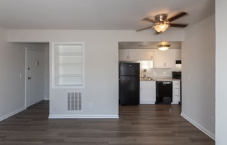 This is a photo of the living room kitchen in an upgraded 500 square foot 1 bedroom, 1 bath Cedar floor plan at Montana Valley Apartments in Cincinnati, OH.