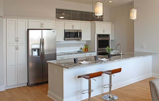 Kitchen Island With Pendent Lights at Residences at Halle, Ohio