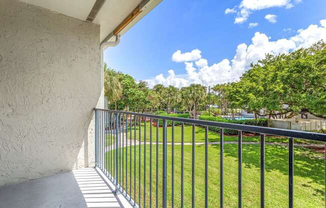 the view from the balcony of a house with a metal fence at Waterford Park Apartment Homes, LLC, Lauderhill, 33319