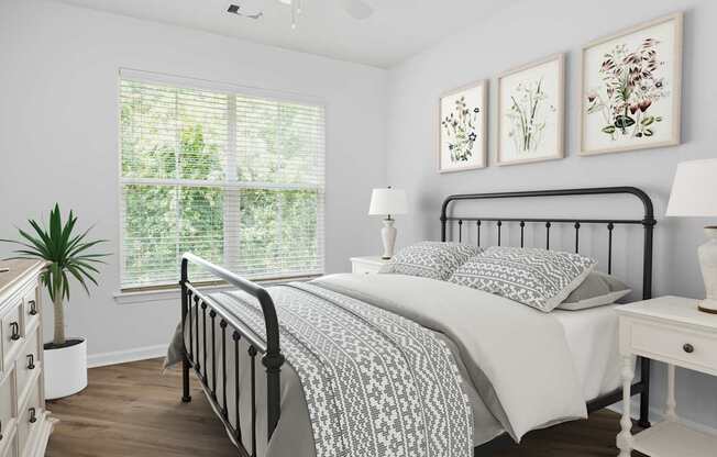 A bedroom with a large bed and a window with blinds.
