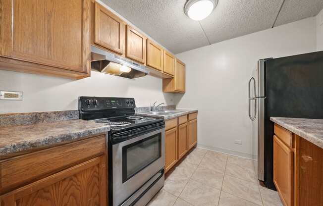 Upgraded Kitchen with cabinets at Woodland Ridge Apartments in Woodridge, IL
