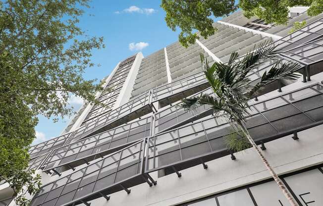 Contemporary high-rise architecture at MB Station in Coral Way, Miami, featuring modern apartment living with convenient access to Downtown Miami, Brickell, and Coral Gables.