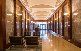 45 Wall St Apartments features a regal entry way with marble columns in the Financial District. 