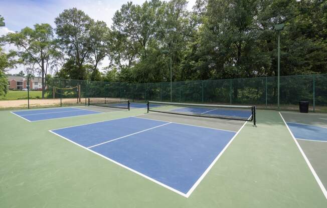 View of pickle ball court with sand volleyball court in back ground