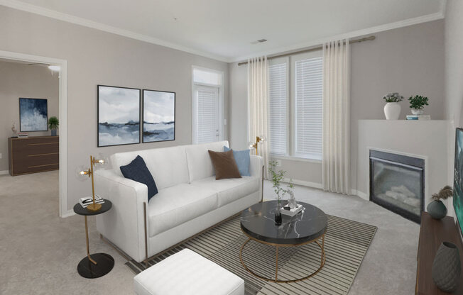 a living room with a white couch and a coffee table