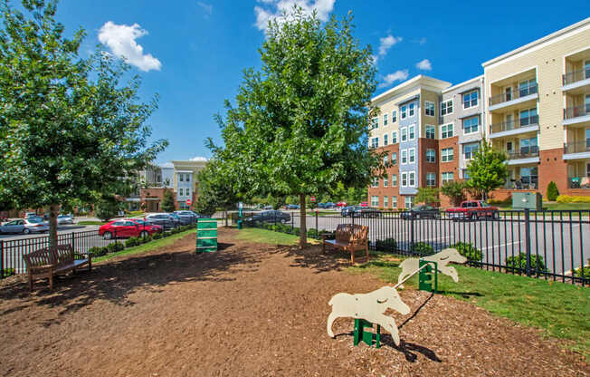 A playground with a slide and a horse-shaped swing set.