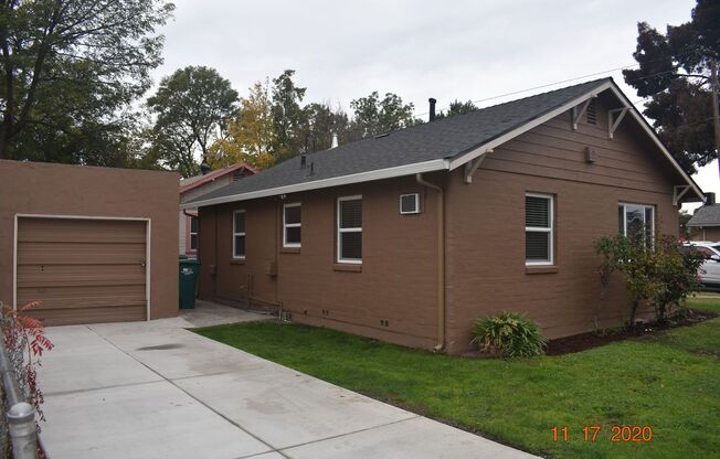 Darling Two Bedroom Home with all New Carpet/ Paint/ Dual Pane Windows/ Garage