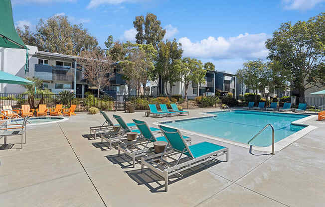 Community Swimming Pool with Pool Furniture at Colonnade at Fletcher Hills Apartments in El Cajon, CA.