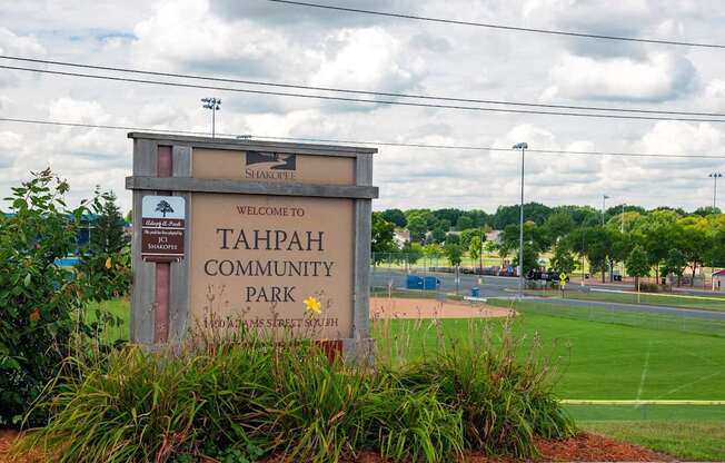 A sign welcoming people to Tahpah Community Park.