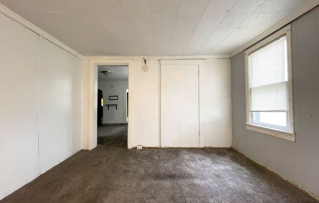 Fall into this cozy 3-Bedroom Home with a fenced in yard & detached garage!