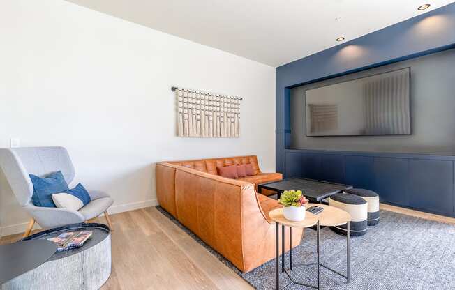 a living room with white walls and a blue accent wall at Marina Square, Bremerton, WA