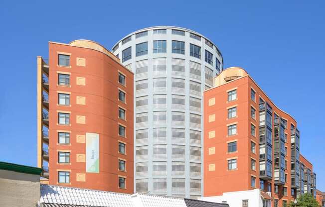 a city building with a blue sky in the background