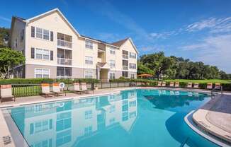 The Colony at Deerwood Apartments - Resort-style swimming pool with lounge area