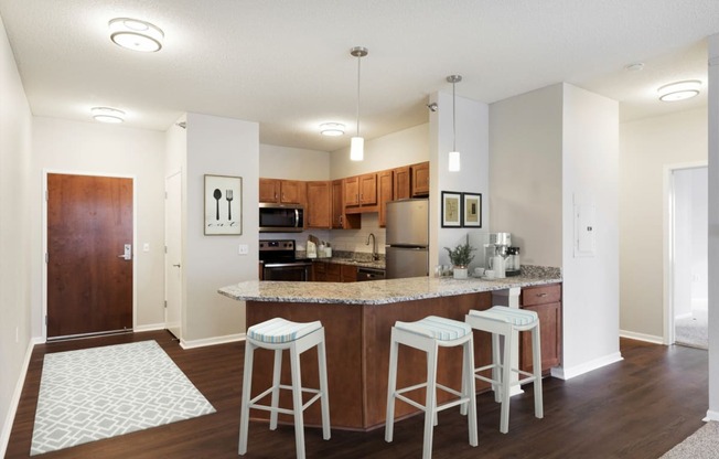 Well Organized Kitchen with Island at Waterstone Place in Minnetonka, MN