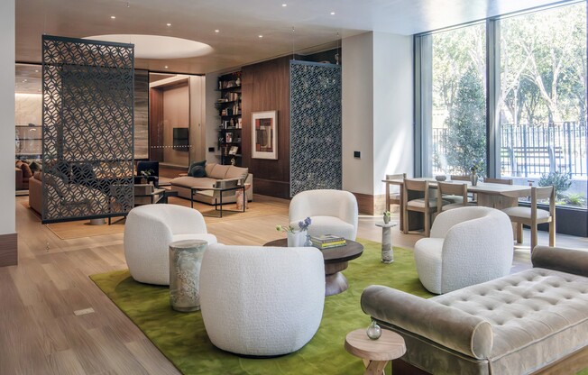 Welcome to Mabel, where modern design meets comfort. Our inviting lounge features lush greenery, stylish seating, and a vibrant atmosphere perfect for relaxation or socializing. Schedule your visit today and see the difference for yourself!