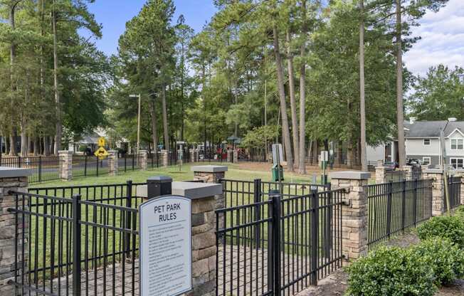 a cemetery with a fence and a sign in front of it at Trails at Short Pump Apartments, Richmond, VA, 23233
