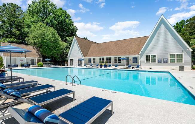 A pool with sun loungers at Dunwoody Glen, Atlanta, GA 30360