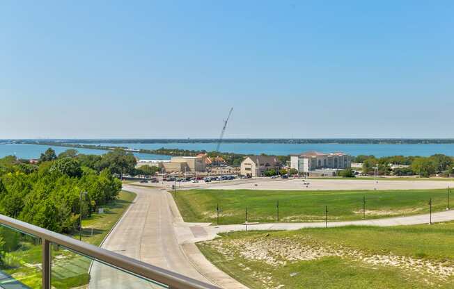 a view of the lake and a city from a balcony