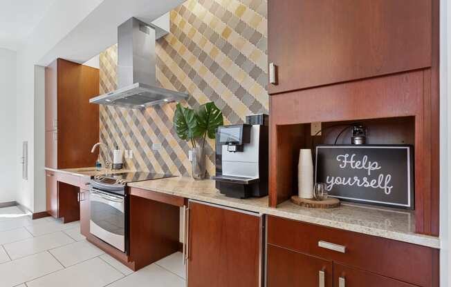 a kitchen with a counter with a sign that says help yourself