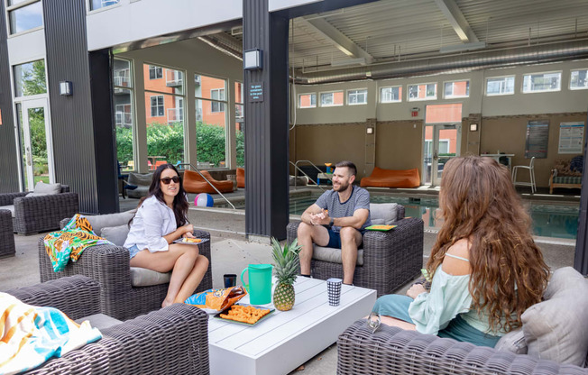 a group of people sitting around a table
