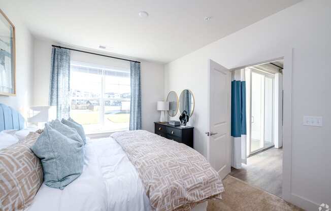 a bedroom with a large bed and a window at Fairmont at South Lake, Maryland, 20716