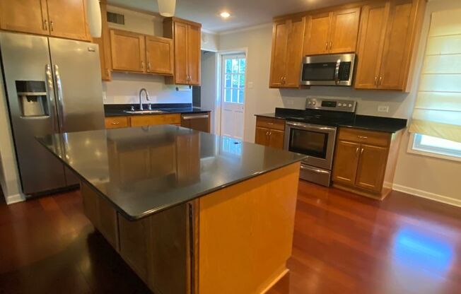 3 Bedroom , 1.5 Bathroom Brick home with carport and fenced yard, with shed,