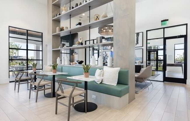 tables, chairs, and bench seating in clubhouse at Lake Nona Concorde