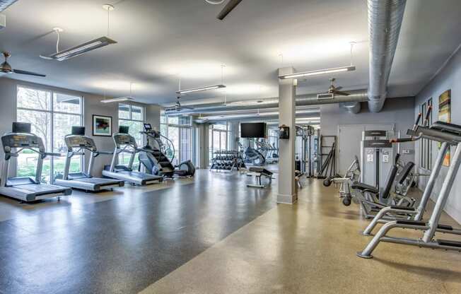 a gym with cardio machines and other exercise equipment