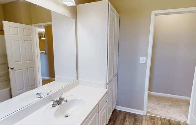 bright bathroom with a big mirror