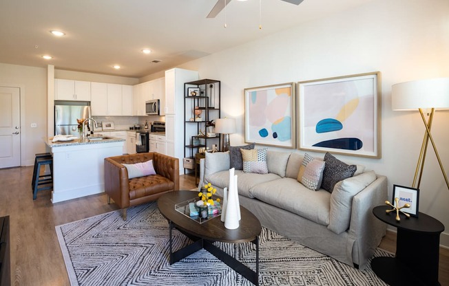 a living room with a couch and a table at The Quincy Apartments, Georgia