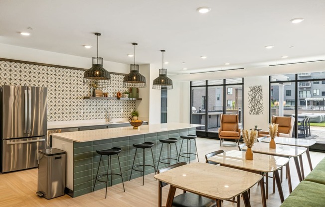 a kitchen and dining area with a counter and stools at EagleRidge Plaza Residences, North Dakota