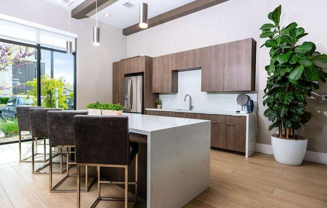 A modern kitchen with a white countertop and brown cabinets.