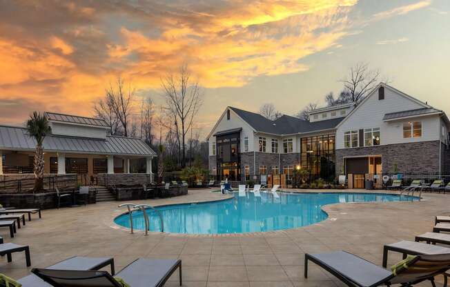 Pool with Clubhouse with Sunset Background