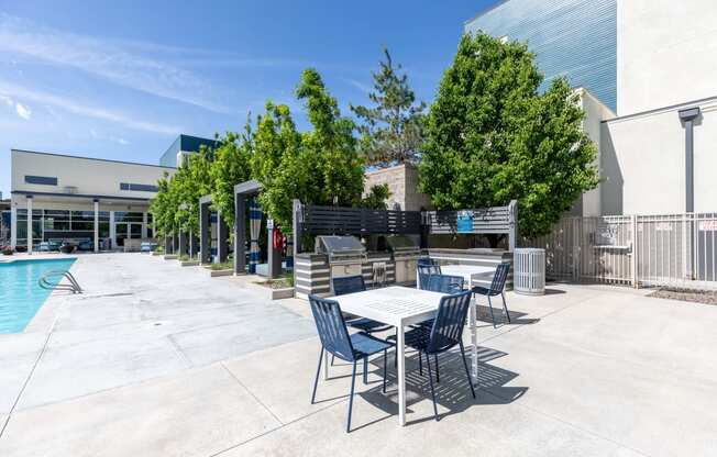 patio with tables near pool