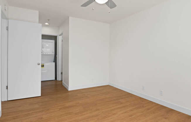 Bedroom with Hard Surface Flooring and In-home Washer and Dryer