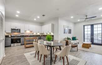 the preserve at ballantyne commons apartments clubhouse with dining table and kitchen