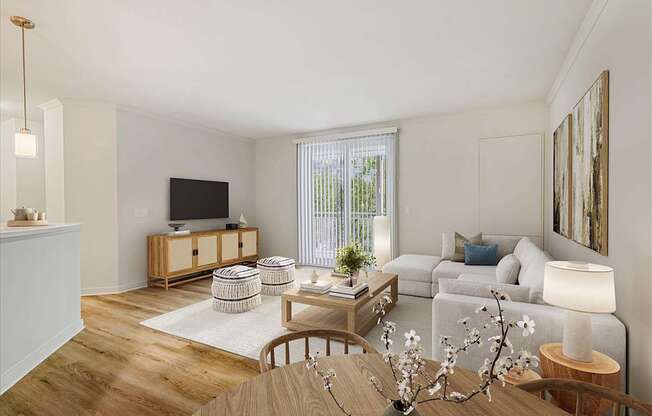 A living room with a wooden floor and furniture.